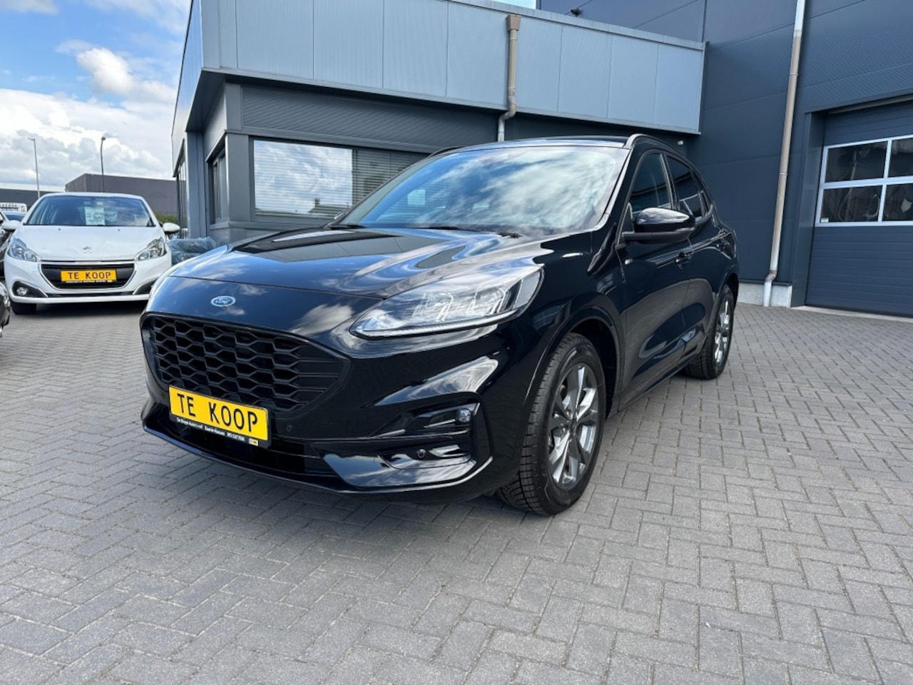 Ford Kuga - 2.5 Hybride Aut. ST-Line Camera stoelverwarming - AutoWereld.nl