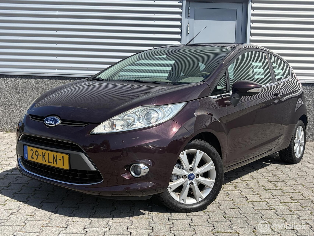 Ford Fiesta - 1.25 Ghia Airco-Cruise-Luce uitvoering - AutoWereld.nl