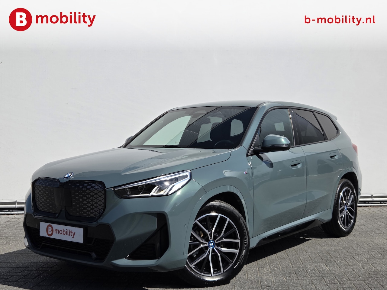 BMW iX1 - eDrive20 67 kWh M-Sport SOH 99% Driving Assist. Plus | Sportstoelen | Park Assist | Leer | - AutoWereld.nl