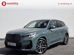 BMW iX1 - eDrive20 67 kWh M-Sport SOH 99% Driving Assist. Plus | Sportstoelen | Park Assist | Leer |