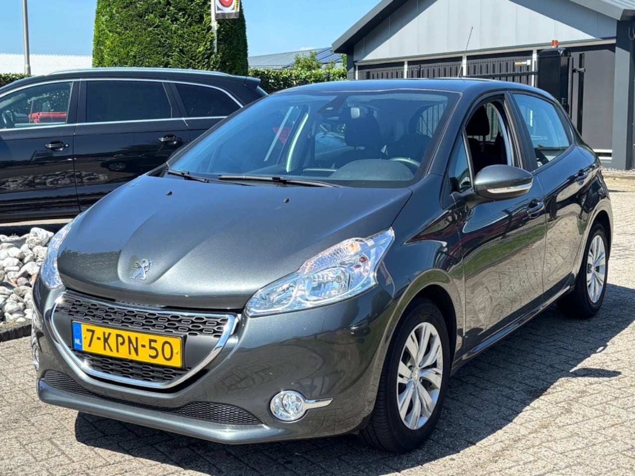 Peugeot 208 - 1.2 VTI Envy 2013 5-Deurs Navi 30.000 KM NL Auto - AutoWereld.nl