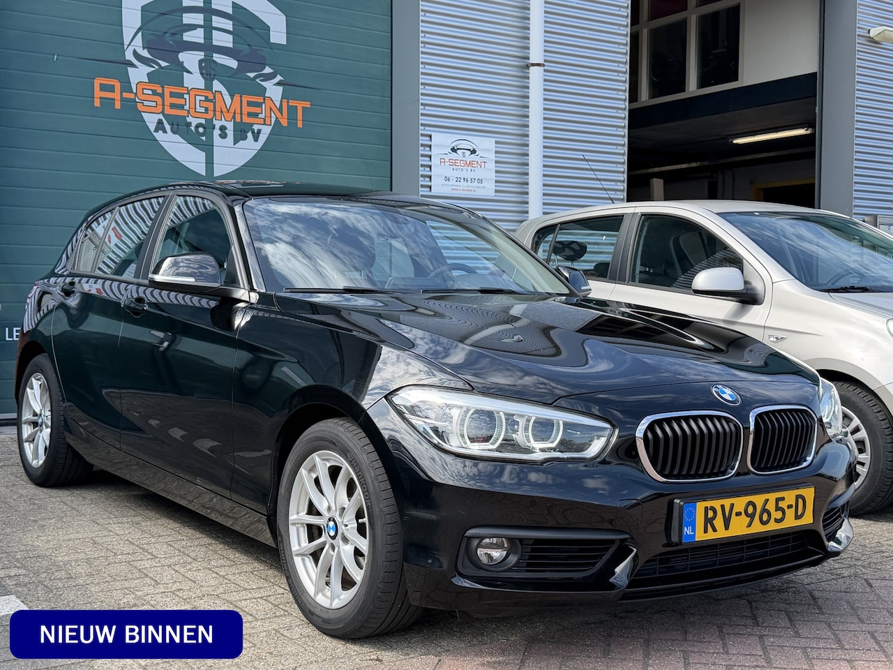 BMW 1-serie - 118i Executive / Automaat / NAP / LED / Navi / Pdc - AutoWereld.nl