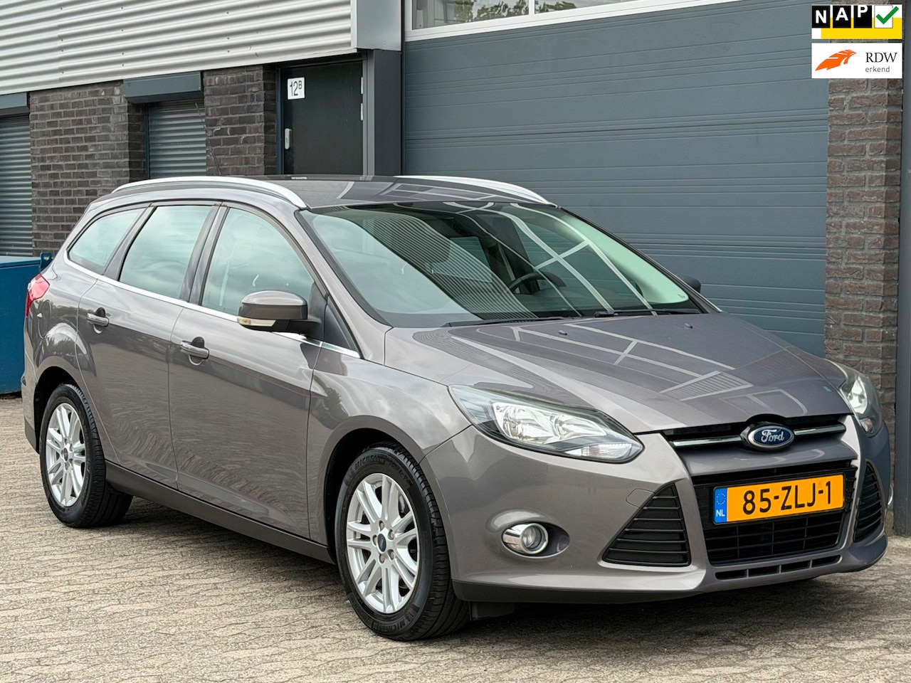 Ford Focus Wagon - 1.6 EcoBoost Titanium NAVI CLIMA CRUISE TREKHAAK PDC - AutoWereld.nl