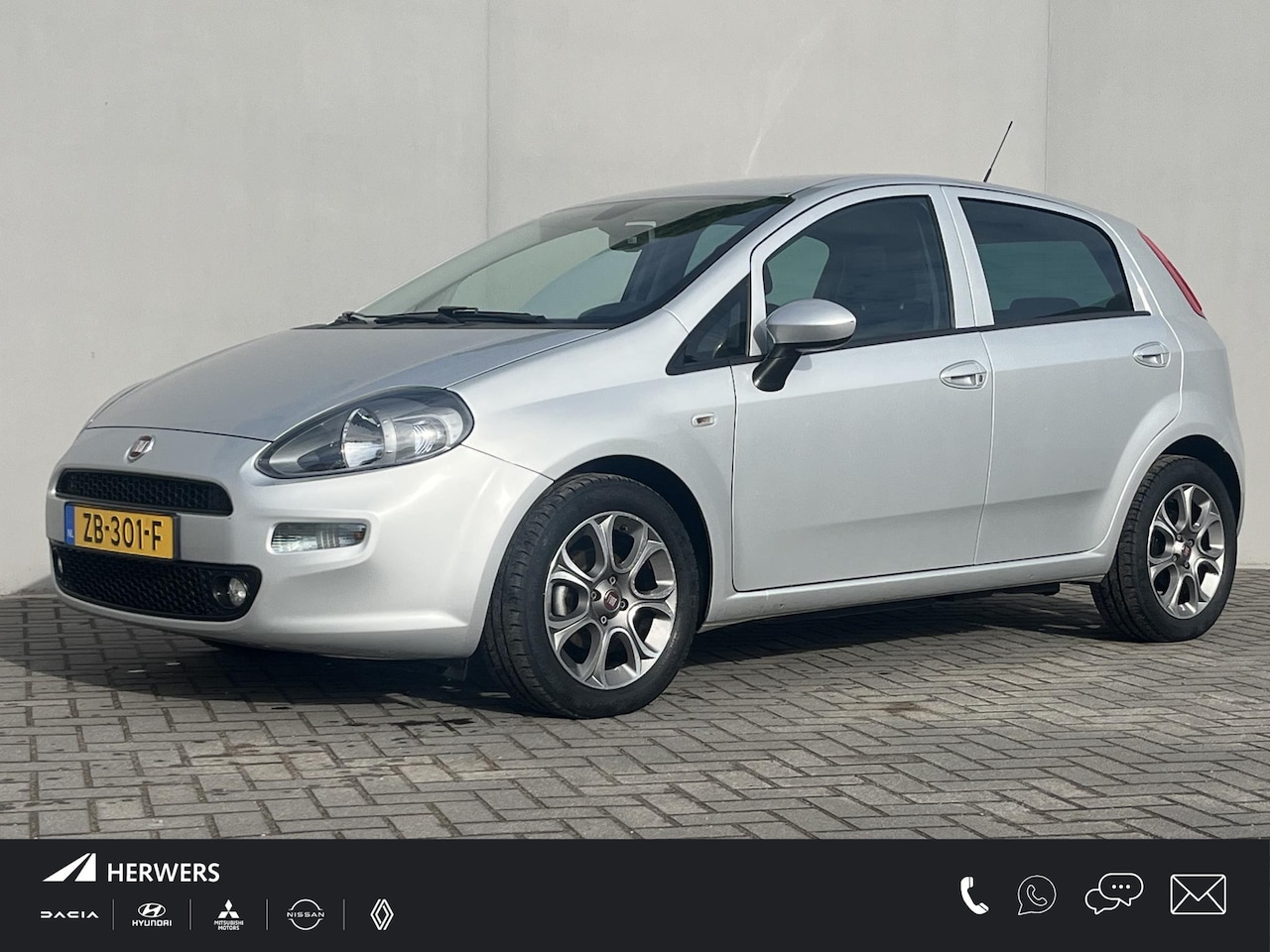 Fiat Punto Evo - 0.9 TwinAir Sempre / Trekhaak (1.000KG) / Navigatie / Bluetooth / Airco / 16'' Lichtmetale - AutoWereld.nl