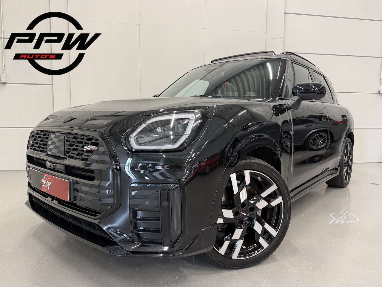 MINI Countryman - 1.5 C JCW XL PANO/EL.TREKHAAK/JCW-LEER+MASSAGE/20"JCW/H&K/HEAD-UP/ADAPTIVE-ONDERSTEL/360CA - AutoWereld.nl