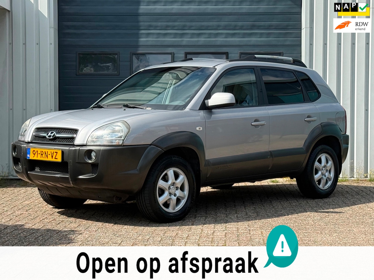 Hyundai Tucson - 2.0i Dynamic AIRCO / 115.781 KM / NAP - AutoWereld.nl