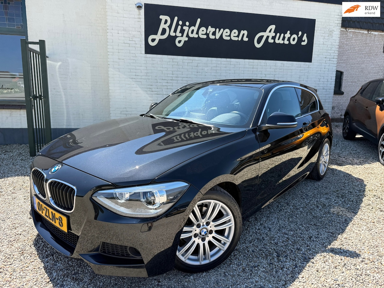 BMW 1-serie - 114i Business+ Clima | Leer | Navi | LM | PDC | Stoel VW - AutoWereld.nl