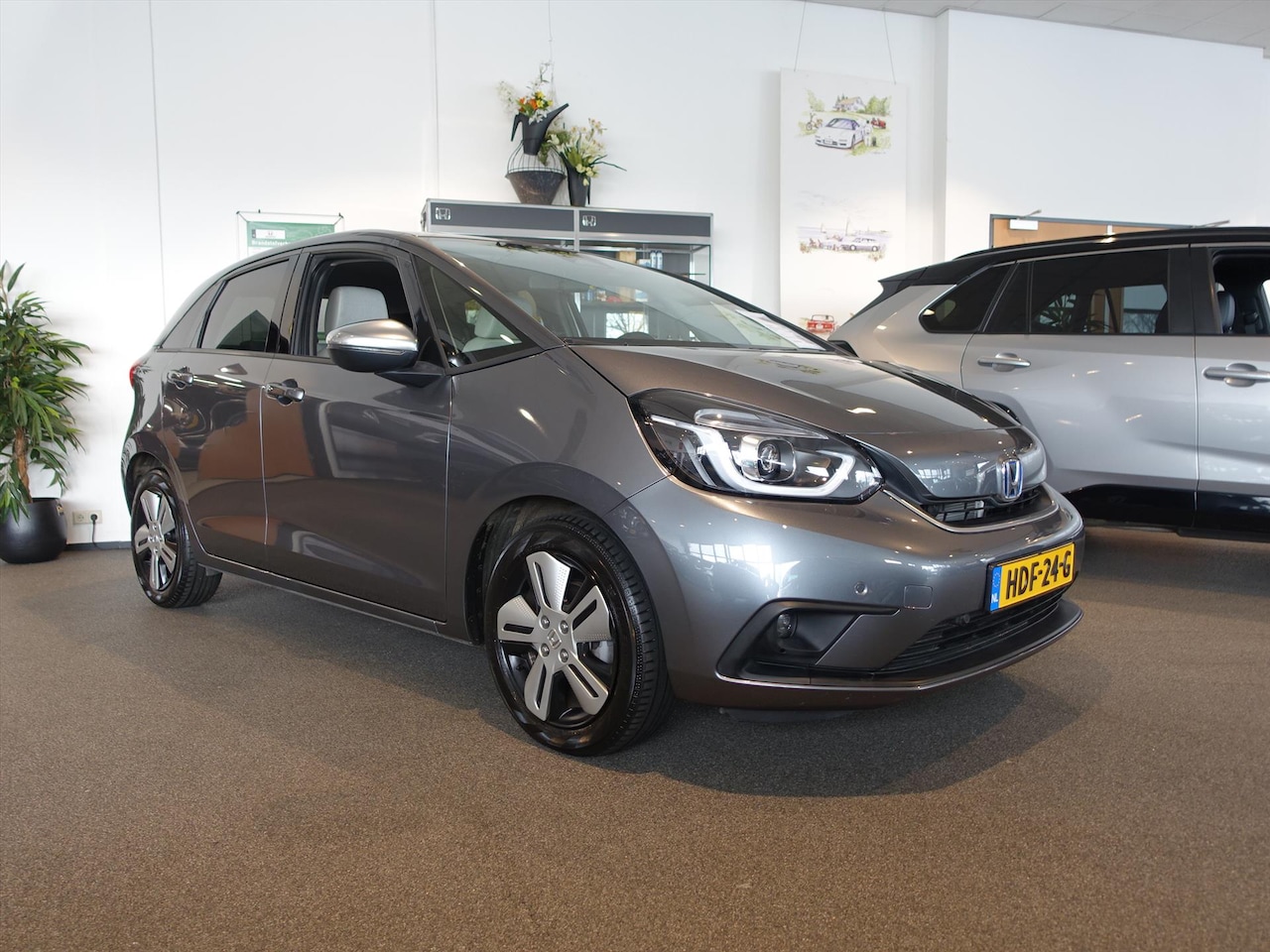 Honda Jazz - 1.5 i-MMD 109pk Hybrid CVT Executive Nieuwstaat 18853 km Trekhaak - AutoWereld.nl