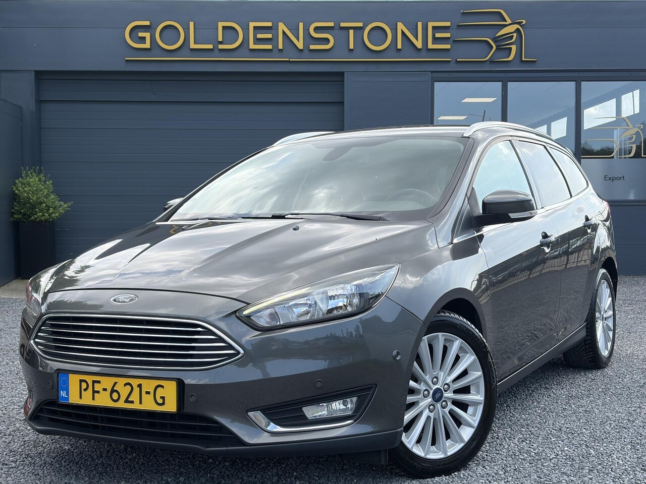 Ford Focus Wagon - 1.0 Titanium 2e Eigenaar,Navi,Trekhaak,125pk,Clima,Cruise,Pdc V+A,6 Bak,Lm velgen,N.A.P,Ap - AutoWereld.nl