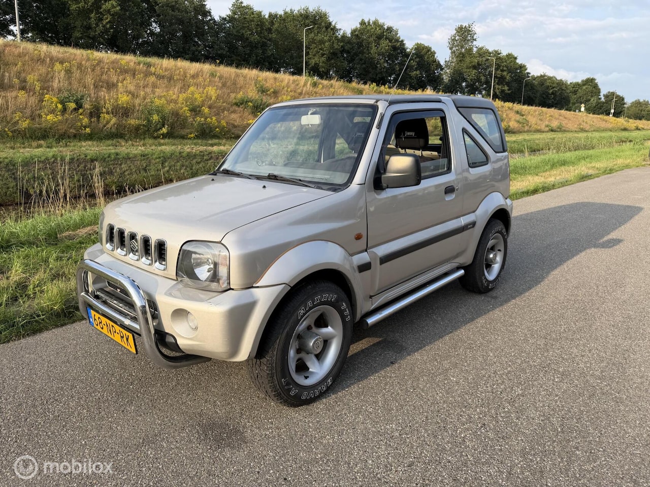 Suzuki Jimny - 1.3 JX 4WD 1.3 JX 4WD - AutoWereld.nl