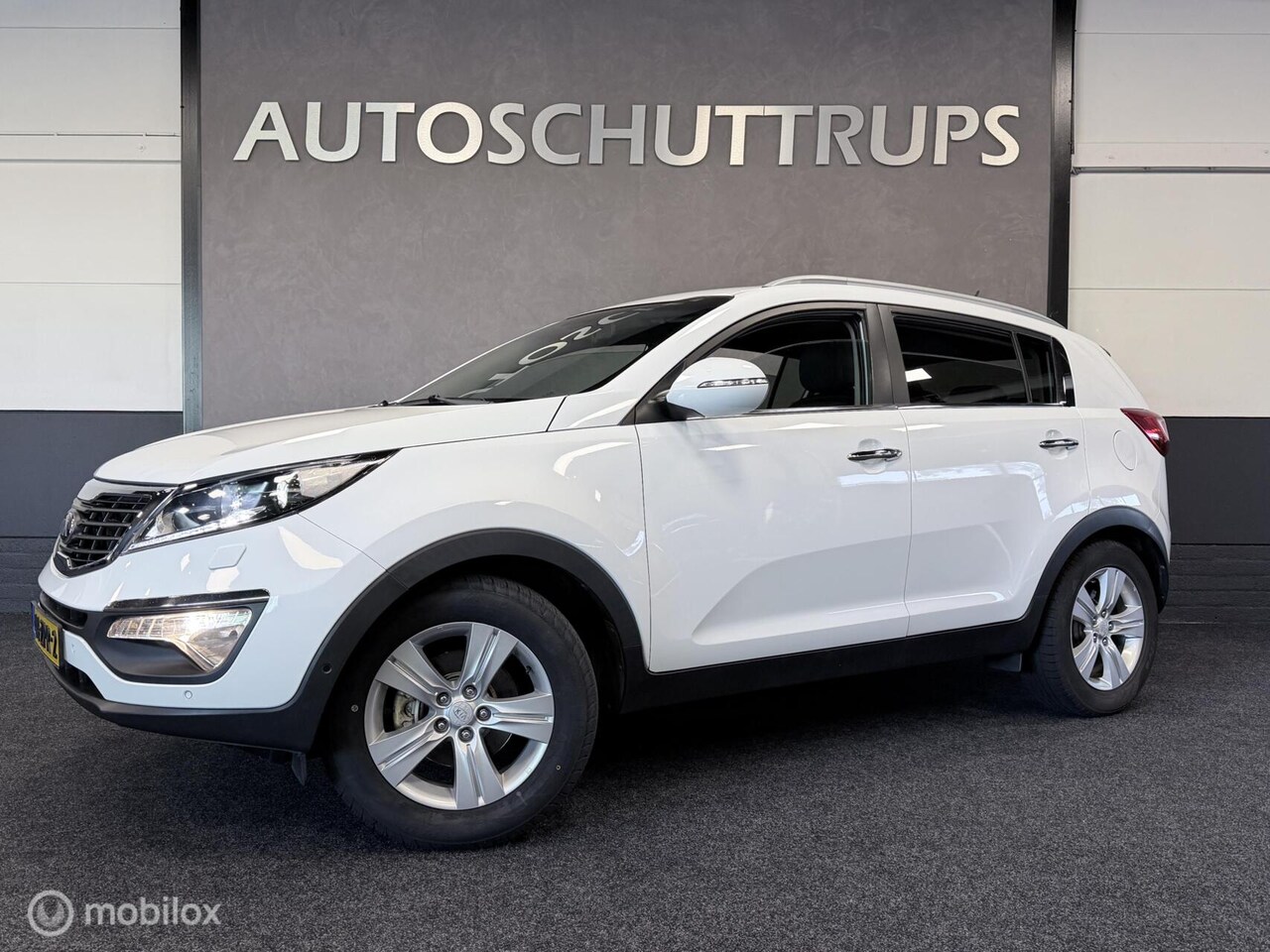 Kia Sportage - 1.6 GDI Super Pack LEER / NAVI / STOELVER. / CAMERA / CRUISE / TREKHAAK / LED - AutoWereld.nl