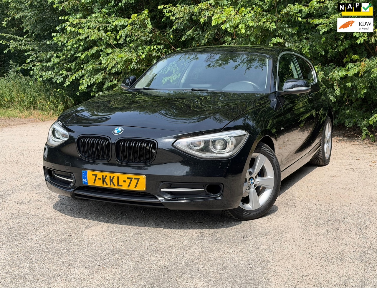 BMW 1-serie - 114i EDE High Executive | Cruise control + Navi + Leder Nu € 4.950,- !!! - AutoWereld.nl