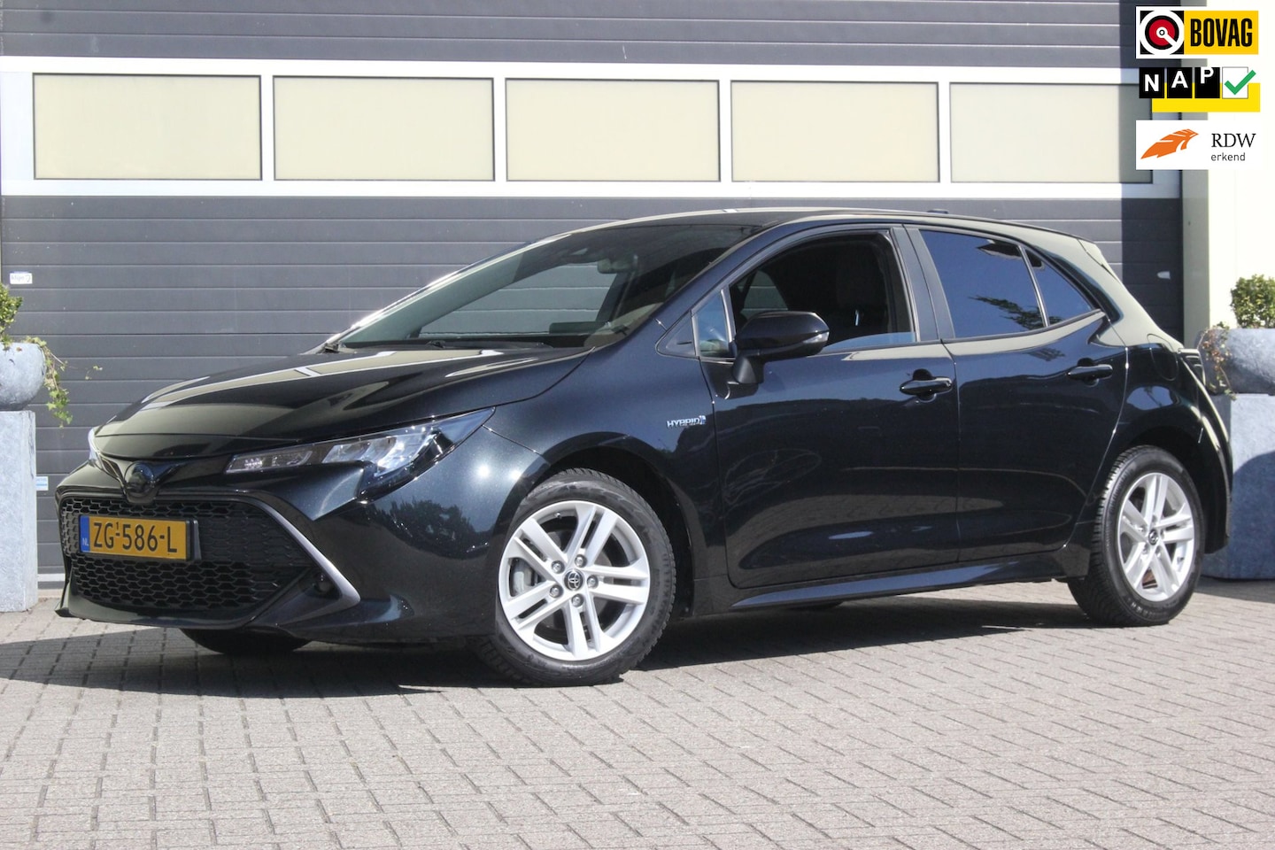 Toyota Corolla - 1.8 Hybrid Active Zwart Camera - AutoWereld.nl