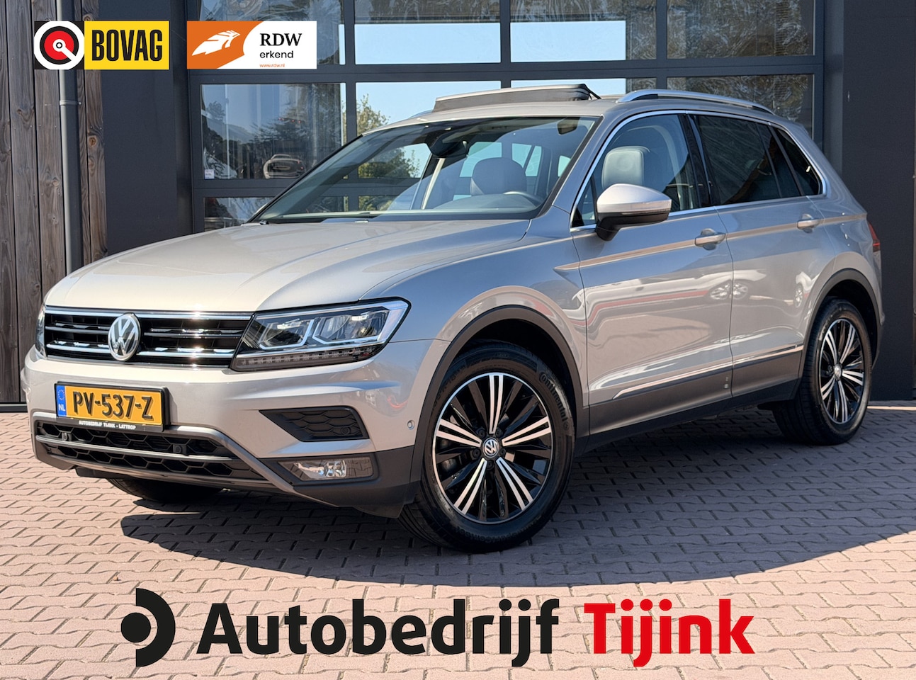 Volkswagen Tiguan - 1.4 TSI 4MOTION Highline | Pano | Trekhaak | LED | Stoelverwarming | Leder | Elek. stoelen - AutoWereld.nl
