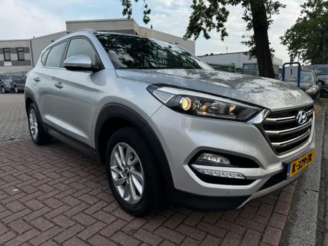 Hyundai Tucson - 1.6 GDi Comfort Airco/ECC,Navi,Camera,Leder - AutoWereld.nl