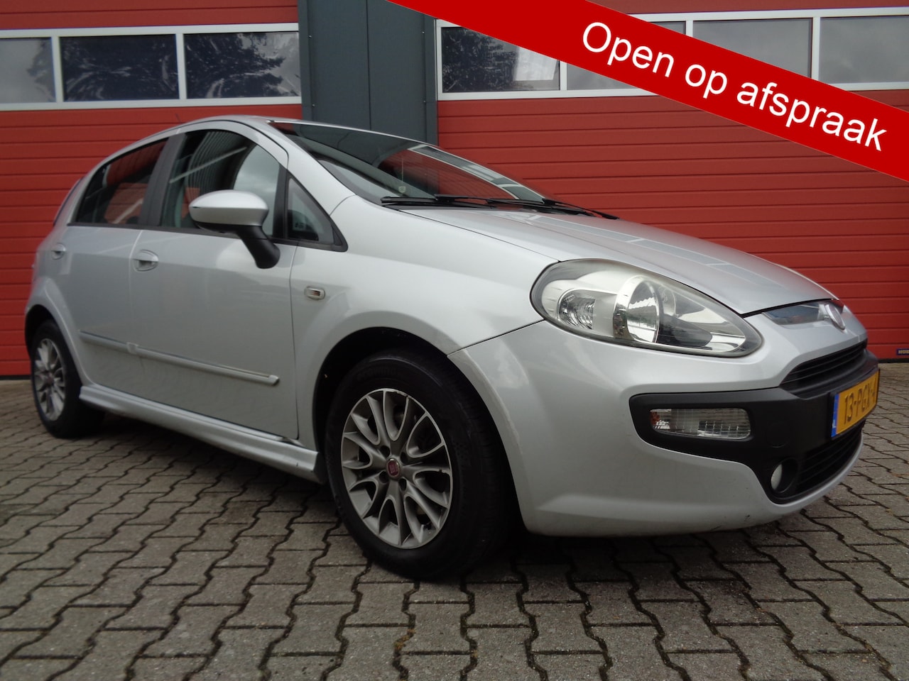 Fiat Punto Evo - 1.3 M-Jet Dynamic Clima Cruise LMV Navi 5DRS 2E-Eigenaar - AutoWereld.nl