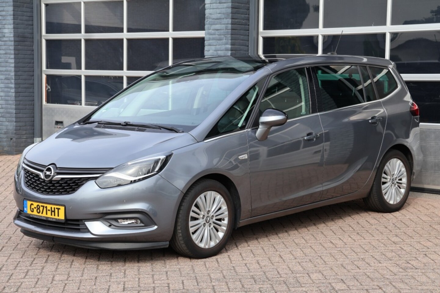 Opel Zafira Tourer - 1.4 T Zafira 7 zitter, panoramadak, camera, navigatie - AutoWereld.nl
