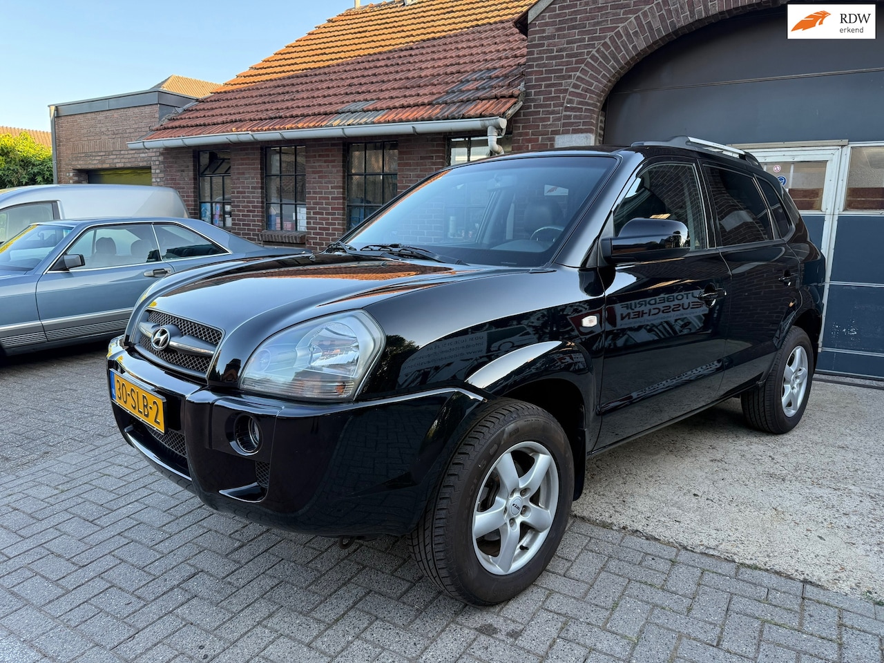 Hyundai Tucson - 2.0i Dynamic World Cup edition I AIRCO I LEDEREN BEKLEDING I - AutoWereld.nl
