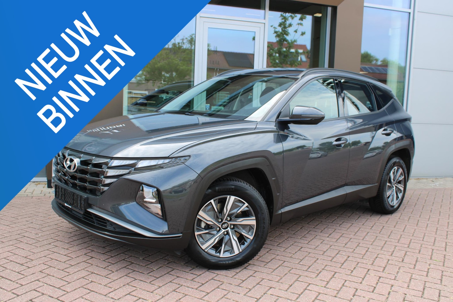 Hyundai Tucson - 1.6 T-GDI HEV 230 Comfort Hybrid Automaat Airco Navi Camera Carplay - AutoWereld.nl