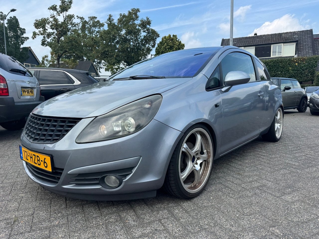Opel Corsa - 1.4-16V Sport 1.4-16V Sport,Apk 26/4/27,Cruise,Dubbele uitlaat,Nap - AutoWereld.nl