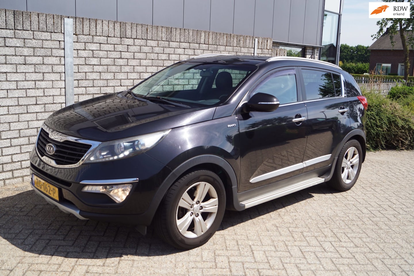 Kia Sportage - 2.0 Plus Pack AWD Autom Sportst Stoelverw A Bankverw Clima Cruise PDC LMV Trekhaak ENZ. - AutoWereld.nl
