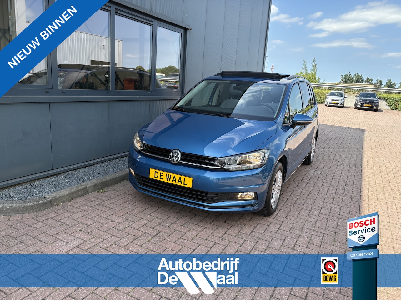 Volkswagen Touran - 1.5 TSi 150pk DSG Comfortline 7-persoons SCHUIFDAK/LEDER/CAMERA/NAVI/ADAPT.CRUISE/WINTERPA - AutoWereld.nl