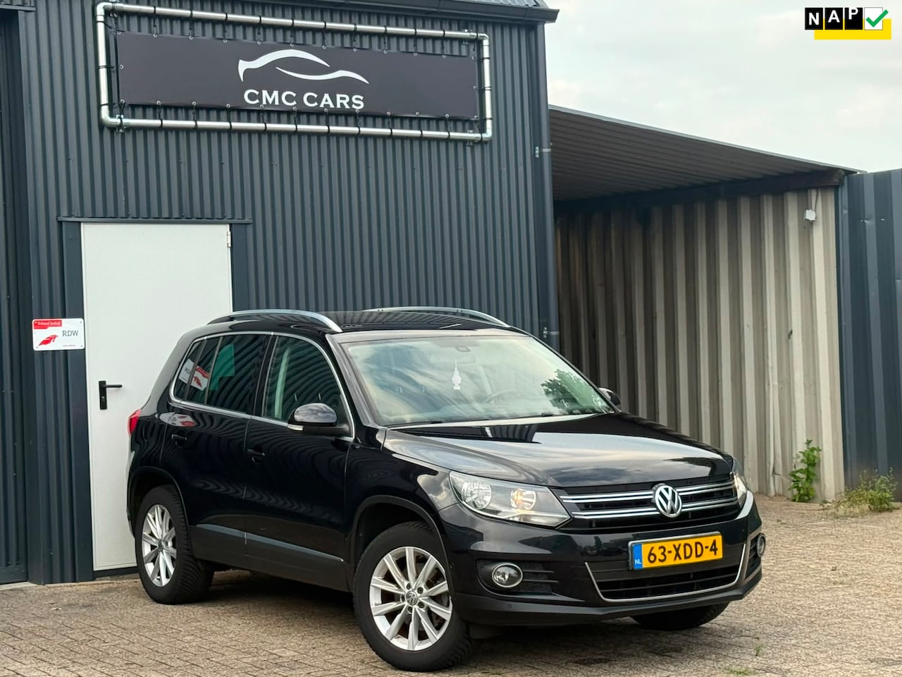 Volkswagen Tiguan - 1.4 TSI Sport&Style NIEUWE KETTING!!//NAP!!//PDC//TREKHAAK!! - AutoWereld.nl