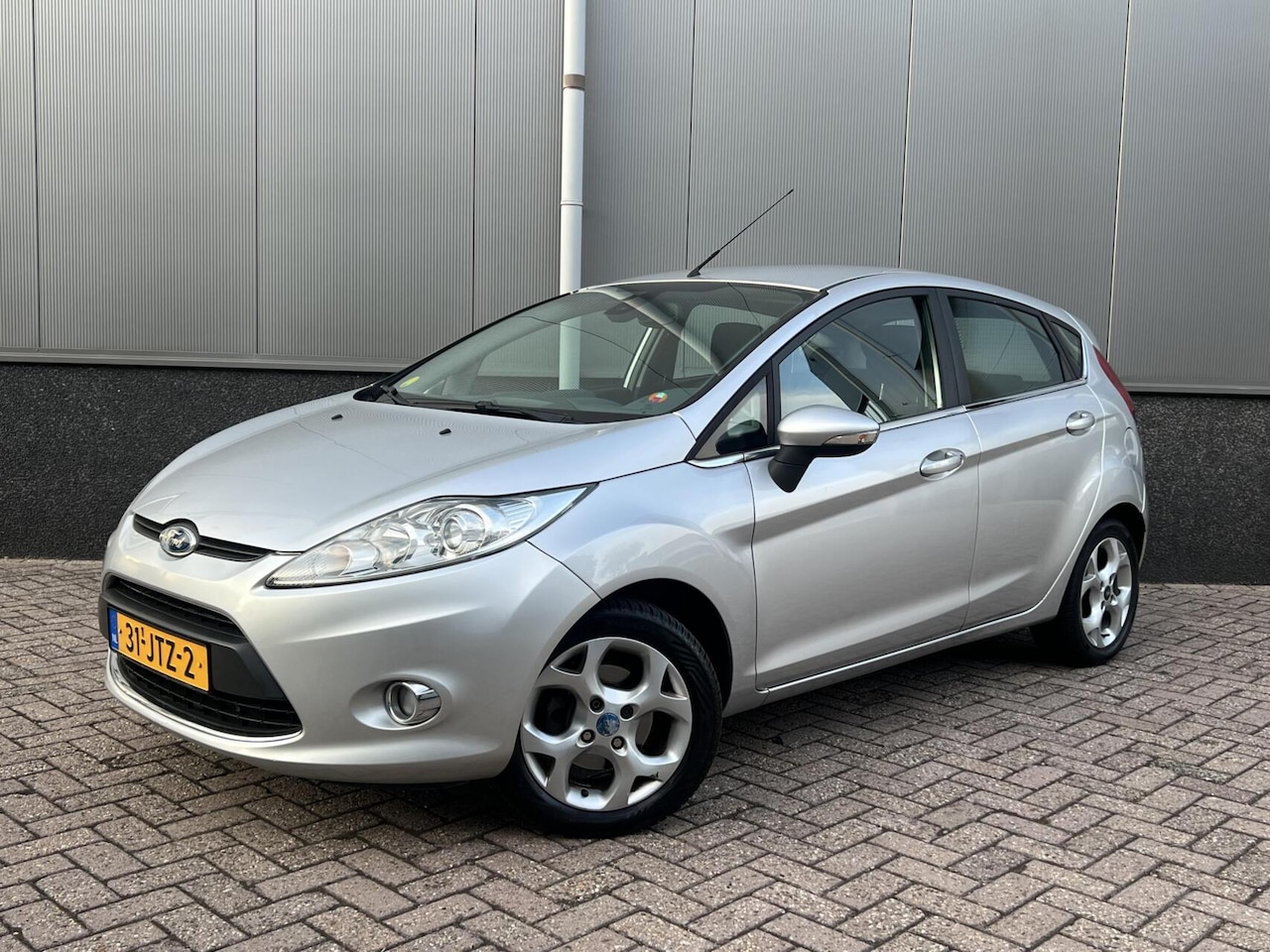 Ford Fiesta - 1.25 Titanium Cruise Climate Parksensor NAP - AutoWereld.nl