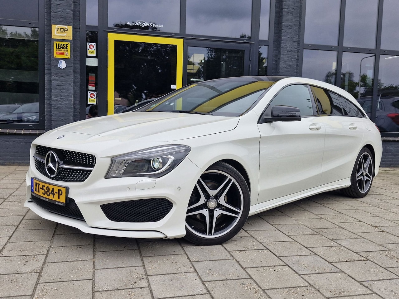 Mercedes-Benz CLA-klasse Shooting Brake - 180 OrangeArt Edition | Schuifdak | Sportstoelen | Camera + Sensoren | Navi | Tel - AutoWereld.nl