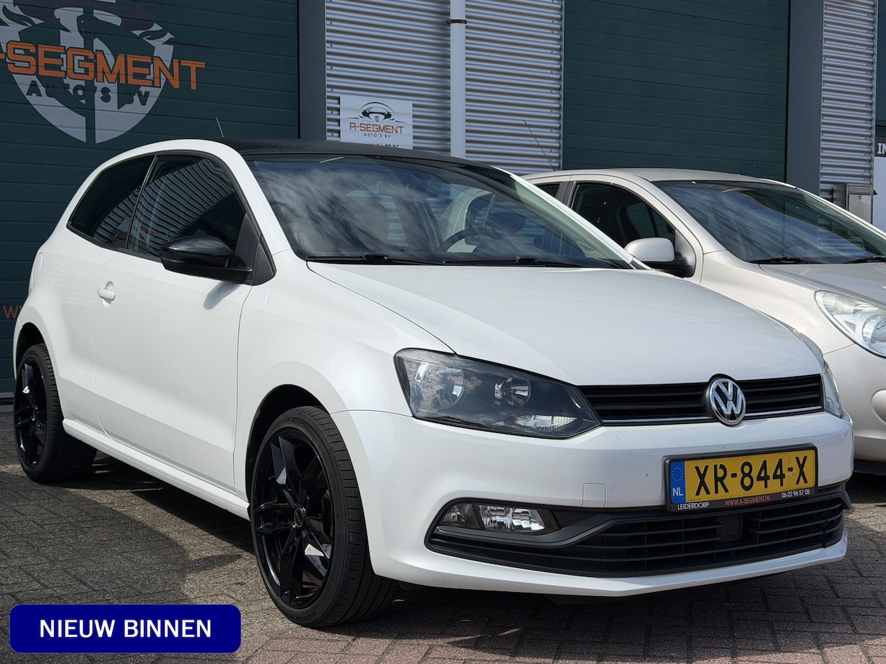 Volkswagen Polo - 1.2 TSI First Edition / Parelmoer / 17" LMV / zwart dak / Clima - AutoWereld.nl