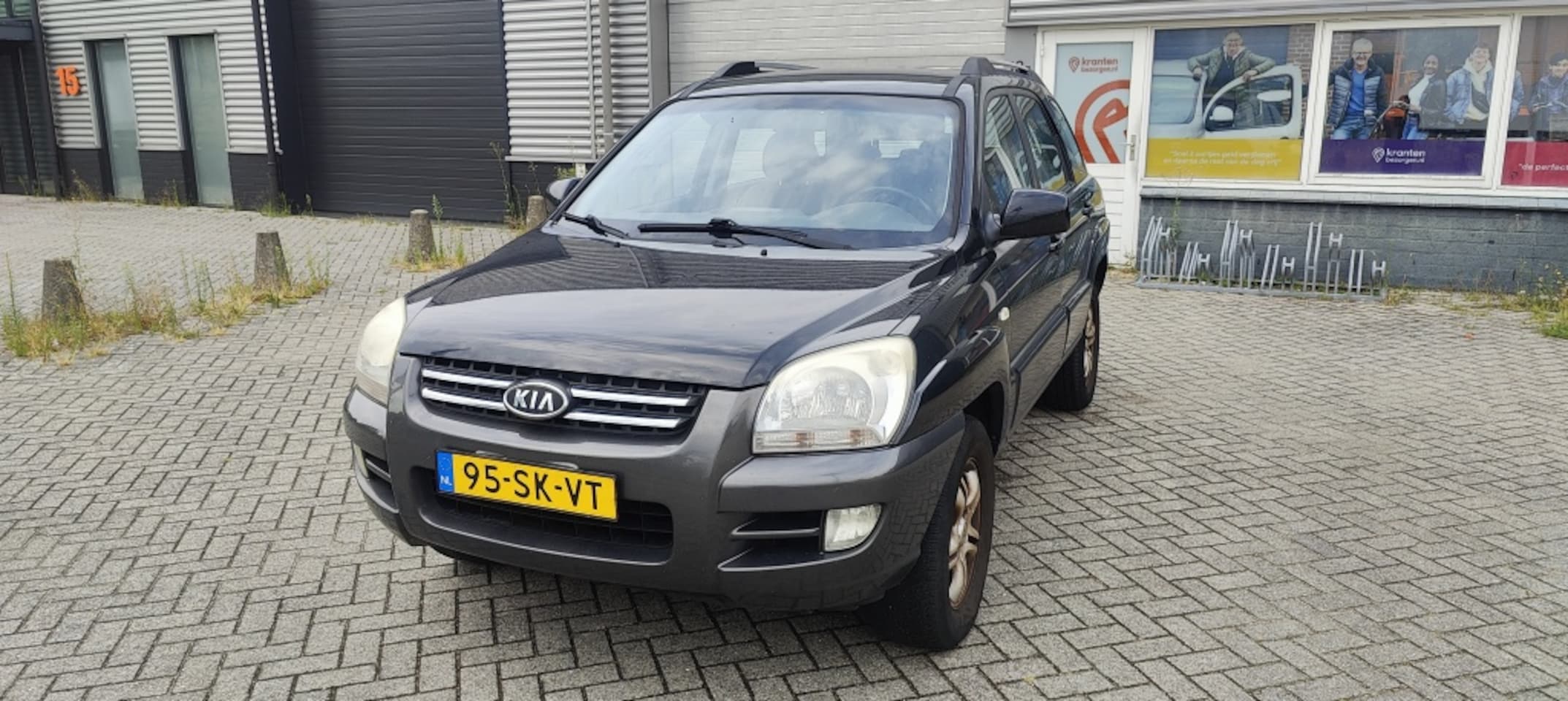 Kia Sportage - 2.0 CVVT Executive 2.0 CVVT Executive - AutoWereld.nl