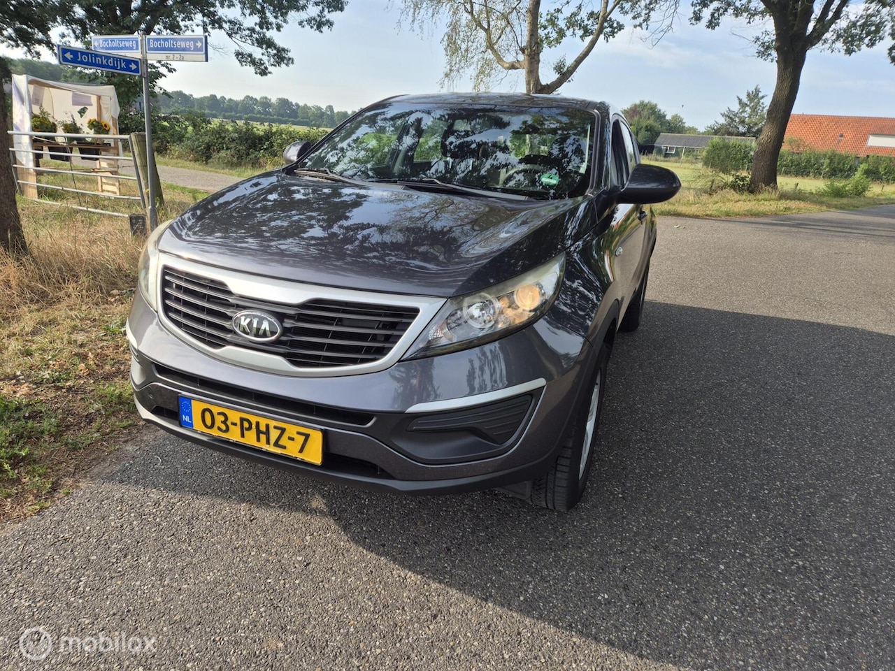 Kia Sportage - 2.0 X-ecutive Plus Pack 2011 airco - AutoWereld.nl