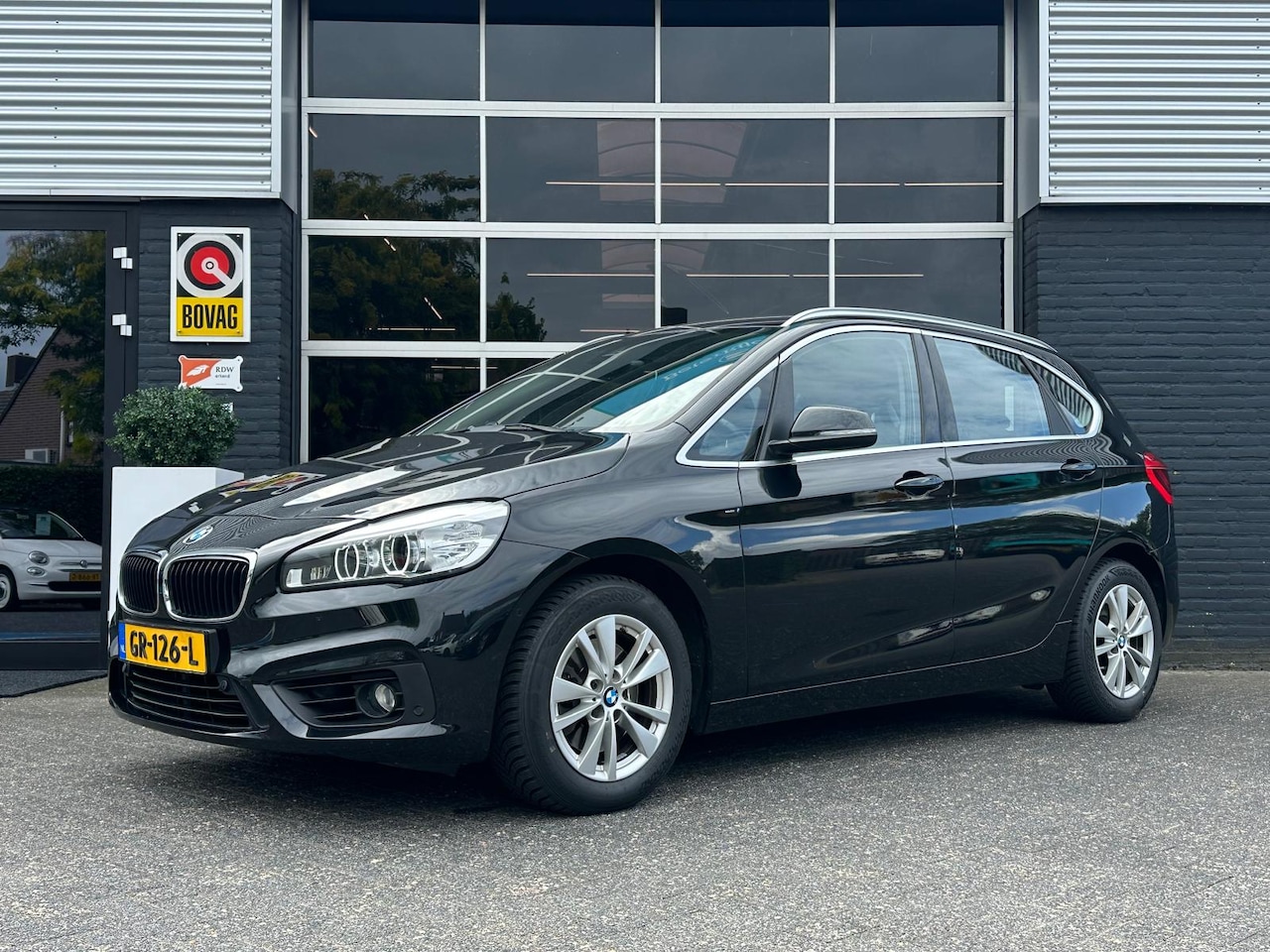 BMW 2-serie Active Tourer - 218i Essential 218i Essential, Automaat, Bluetooth, Cruise, Navi, Trekhaak, PDC, NAP - AutoWereld.nl