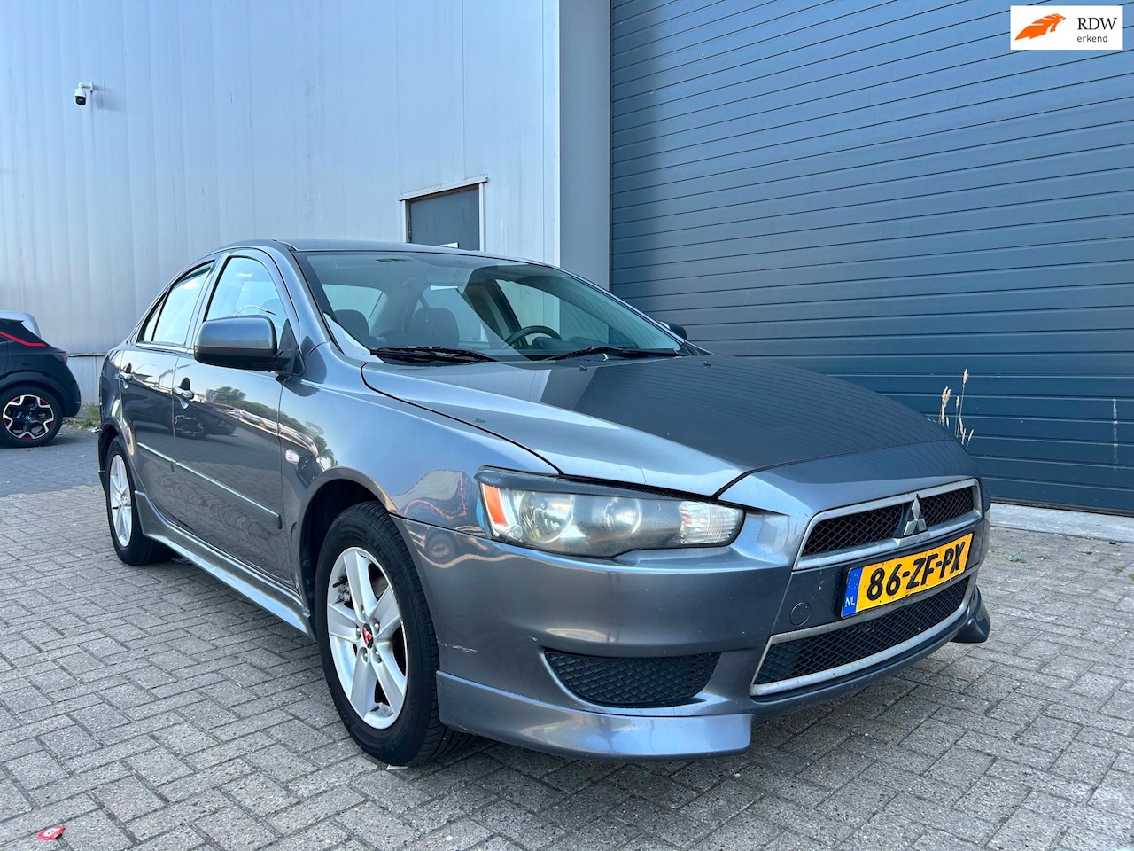 Mitsubishi Lancer Sports Sedan - 1.5i Invite AIRCO - AutoWereld.nl