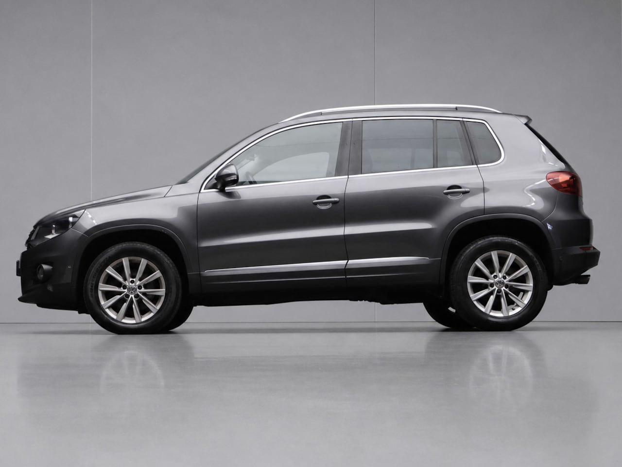 Volkswagen Tiguan - 1.4 TSI Sport&Style Sport (NAVI,CRUISE,CLIMATE,PDC,PARKEERHULP,SPORTSTOELEN,LM VELGEN,NETT - AutoWereld.nl
