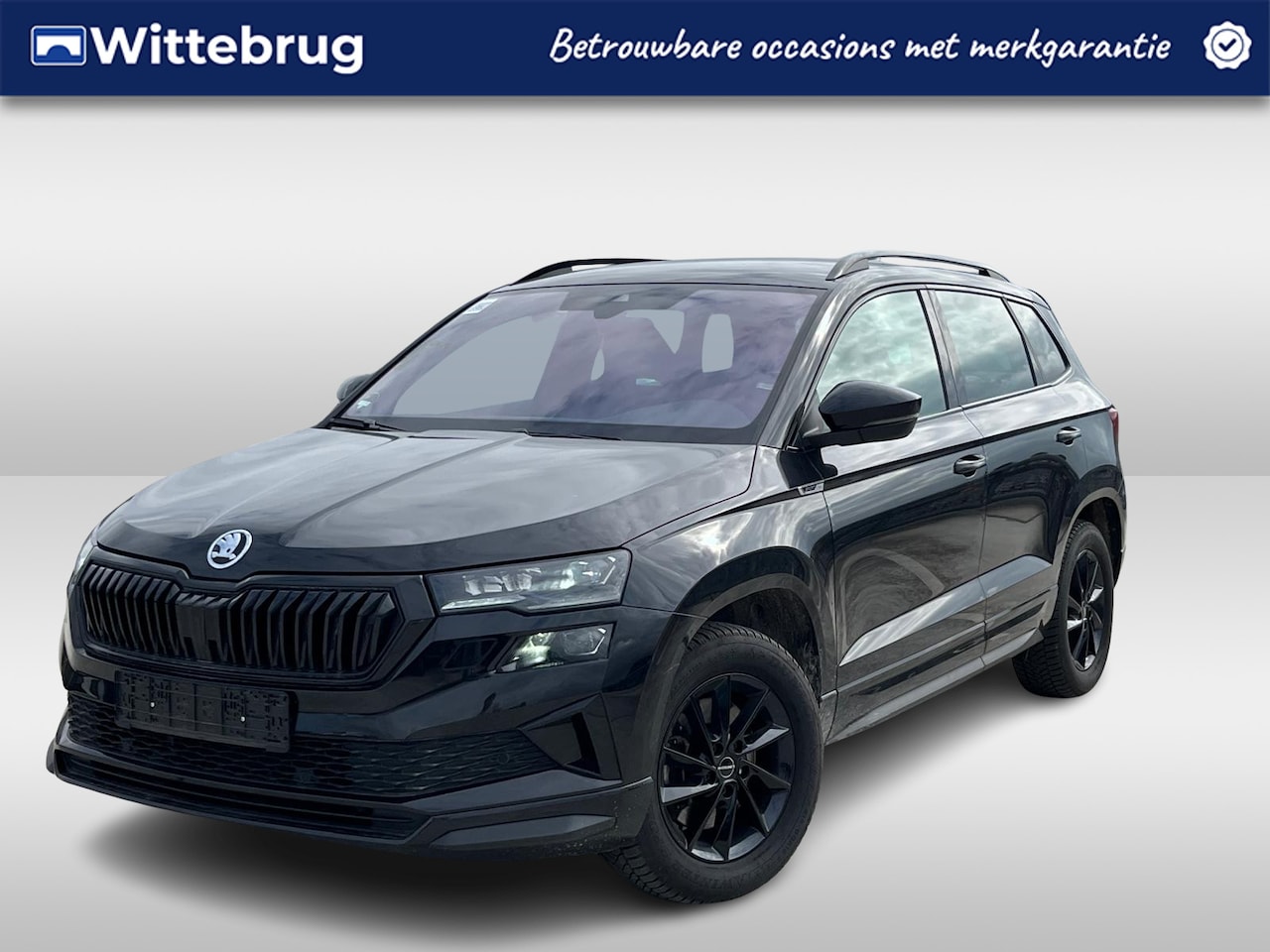 Skoda Karoq - 1.5 TSI ACT Sportline Business / 18"LMV / TREKHAAK / NAVI / APP.Connect / Elektr. Klep / C - AutoWereld.nl