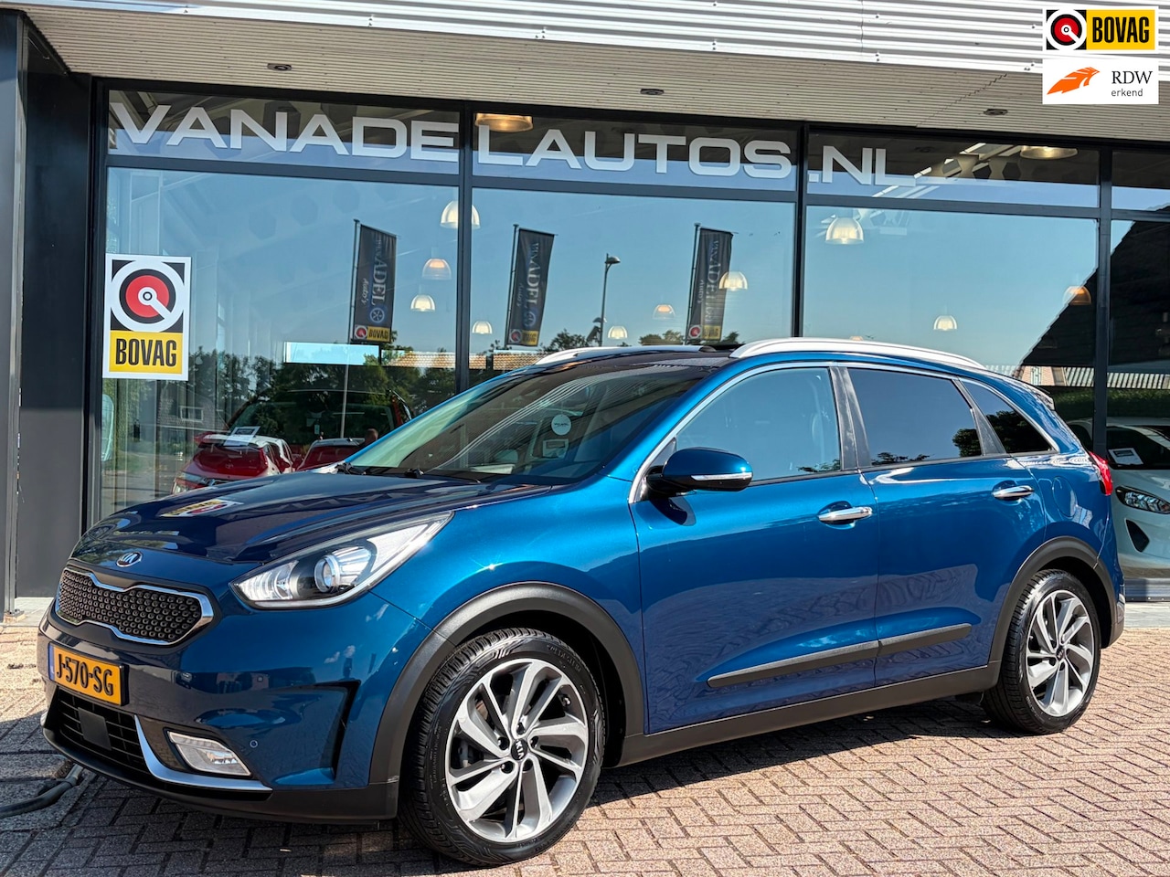 Kia Niro - 1.6 GDi Hybrid Business Aut. El.Schuifdak Adap. Cruise Leer Navi Camera Trekhaak Dealerond - AutoWereld.nl