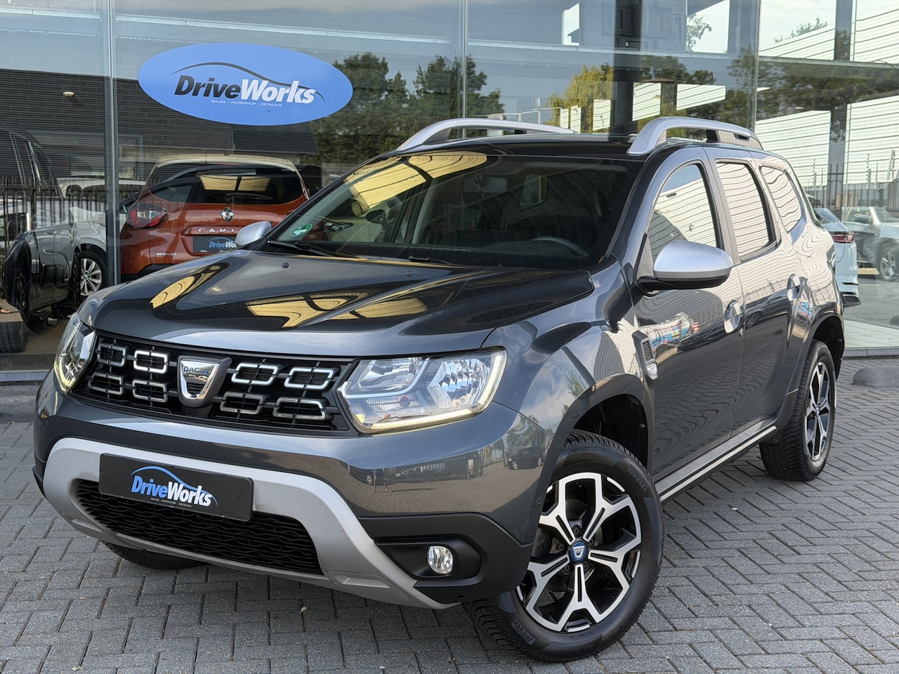 Dacia Duster - 1.3 TCe Prestige | 130 pk | Camera | Navi | Weinig km |  Interesse, Proefrit? Bel of app m - AutoWereld.nl