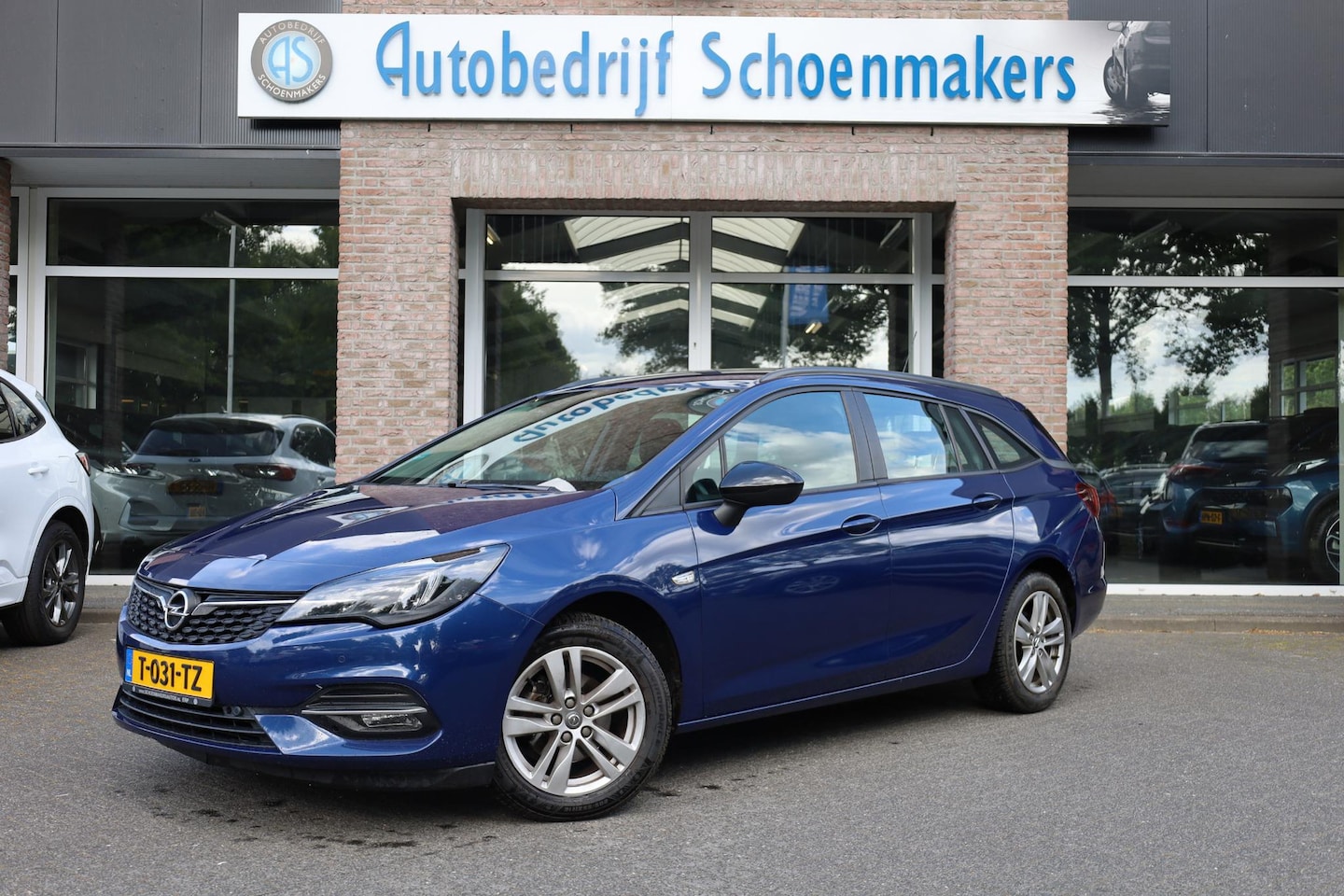 Opel Astra Sports Tourer - 1.2 TREKHAAK CAMERA ALL-SEASONS CARPLAY DAB CRUISE NAVI LMV 2xPDC AIRCO - AutoWereld.nl