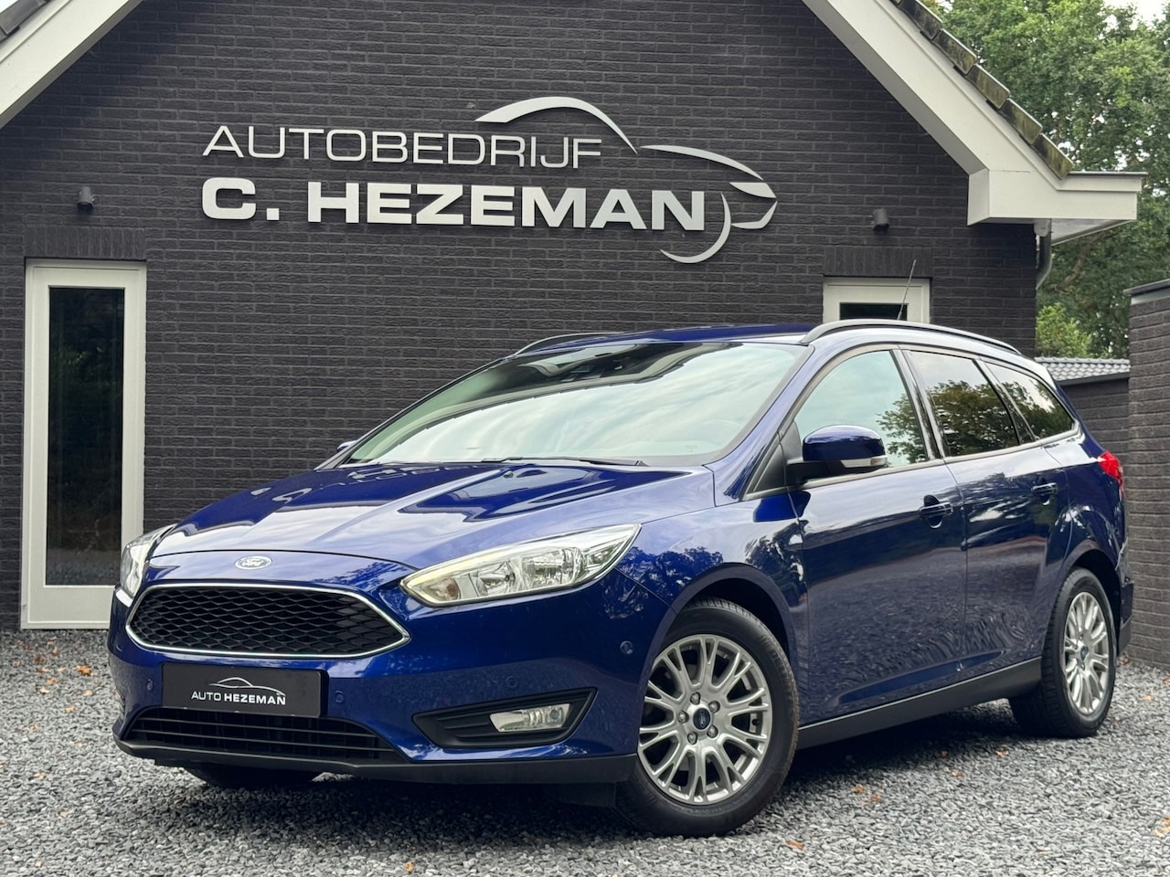 Ford Focus Wagon - 1.0 Titanium 125PK Navigatie Stoelverwarming Cruise Climate Control - AutoWereld.nl