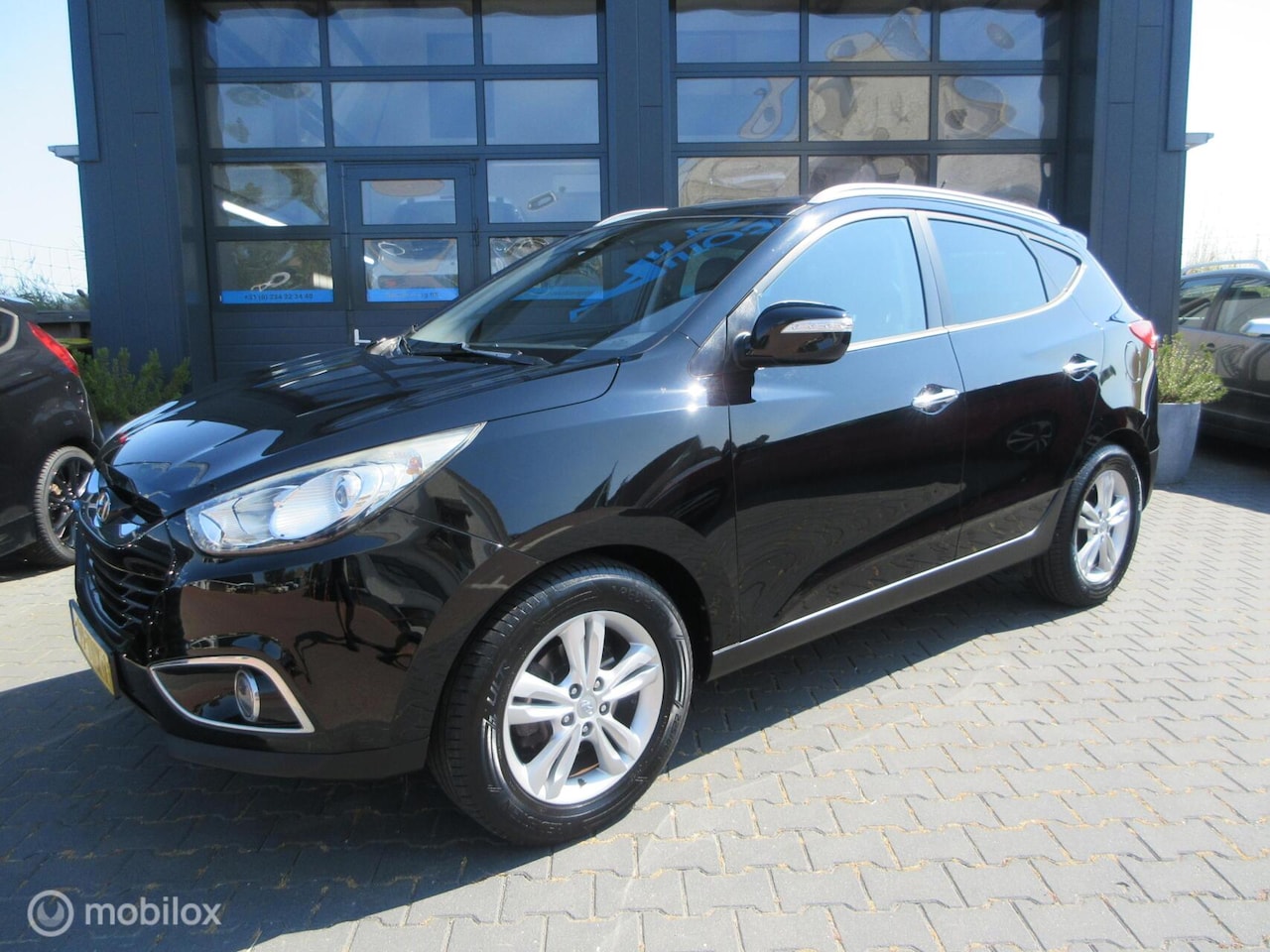 Hyundai ix35 - 1.6i GDI Style Airco Cruise Camera Trekhaak - AutoWereld.nl