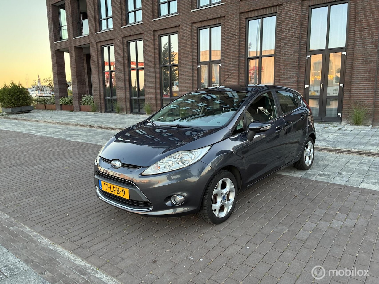 Ford Fiesta - 1.25 Titanium Cruise Clima Trekhaak PDC - AutoWereld.nl