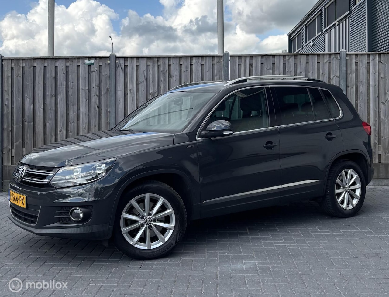 Volkswagen Tiguan - 1.4 TSI Sport&Style/STOELVW/NAVI/PDC/ - AutoWereld.nl