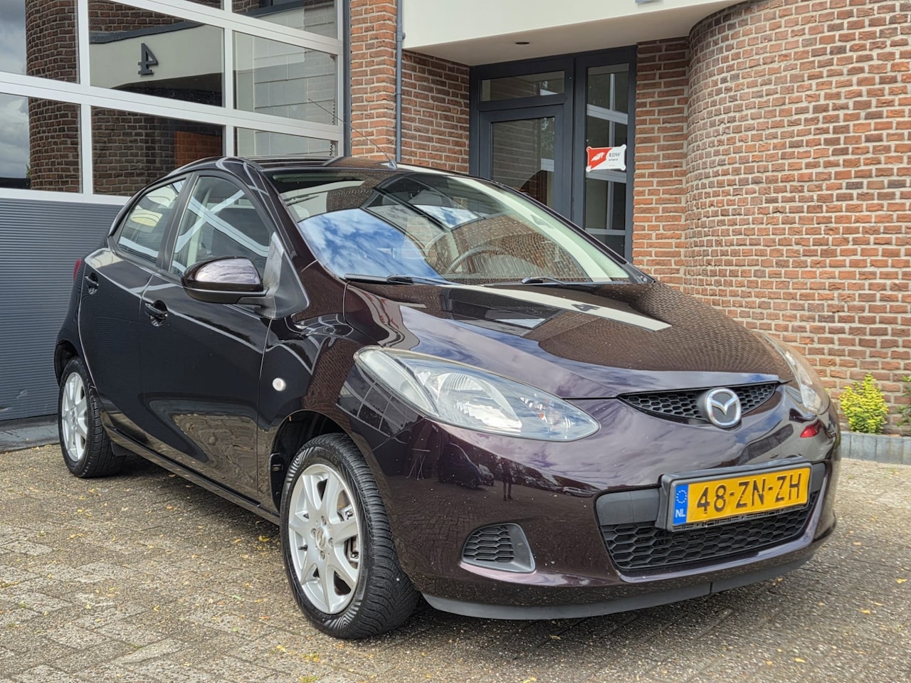 Mazda 2 - 1.3hp S-VT Touring | Airco | LMV | Nap | Apk - AutoWereld.nl