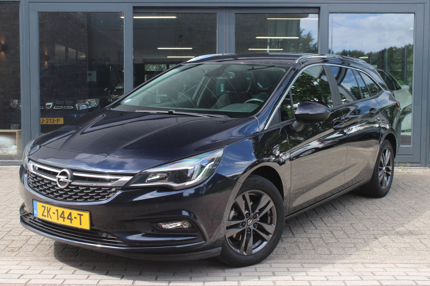 Opel Astra Sports Tourer - 1.0 Turbo 120 Jaar Edition | Trekhaak | Cruise-Control | Telefoonvoorbereiding | Parkeerse - AutoWereld.nl
