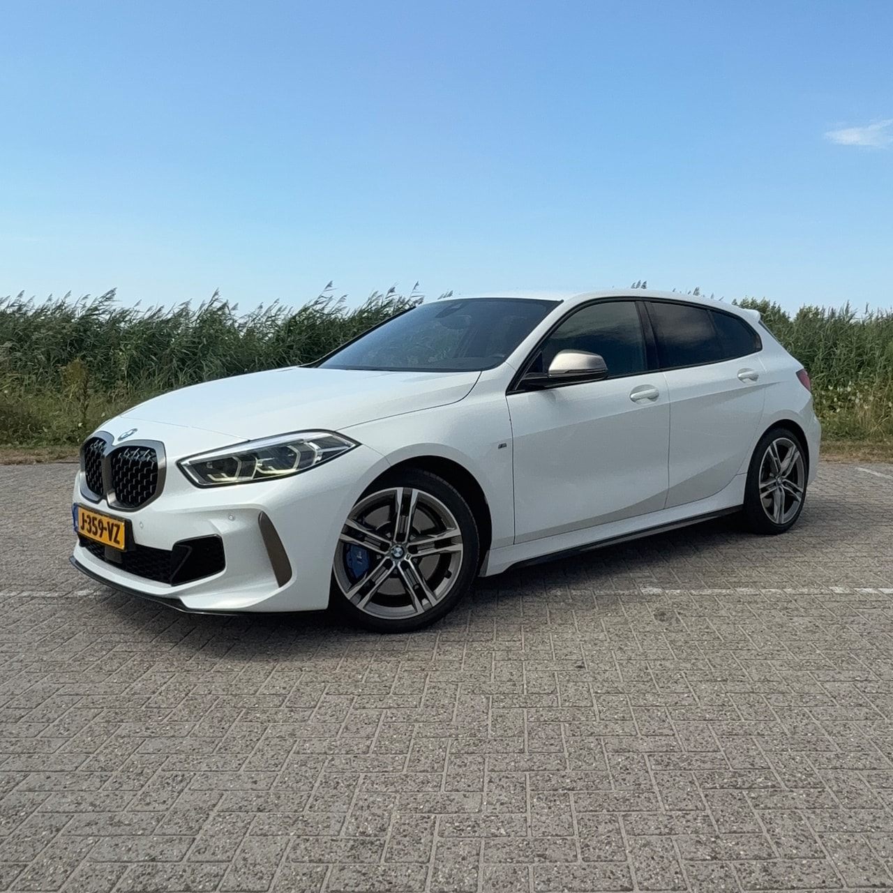 BMW 1-serie - M135i xDrive M-pakket, Sportstoelen, HUD, - AutoWereld.nl
