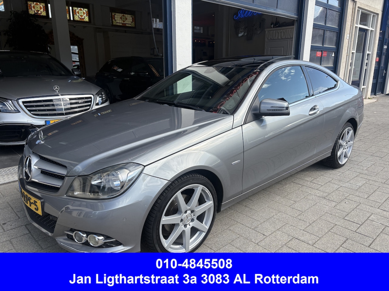 Mercedes-Benz C-klasse Coupé - 180 NL AUTO/PANORAMA/LEDER - AutoWereld.nl