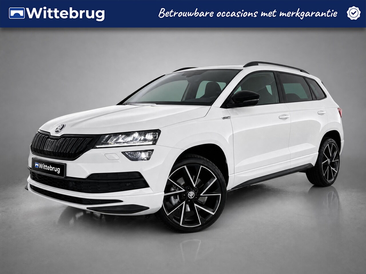 Skoda Karoq - 1.5 TSI ACT Sportline Business / Pano / App connect / Navigatie / Camera / Parkeersensoren - AutoWereld.nl