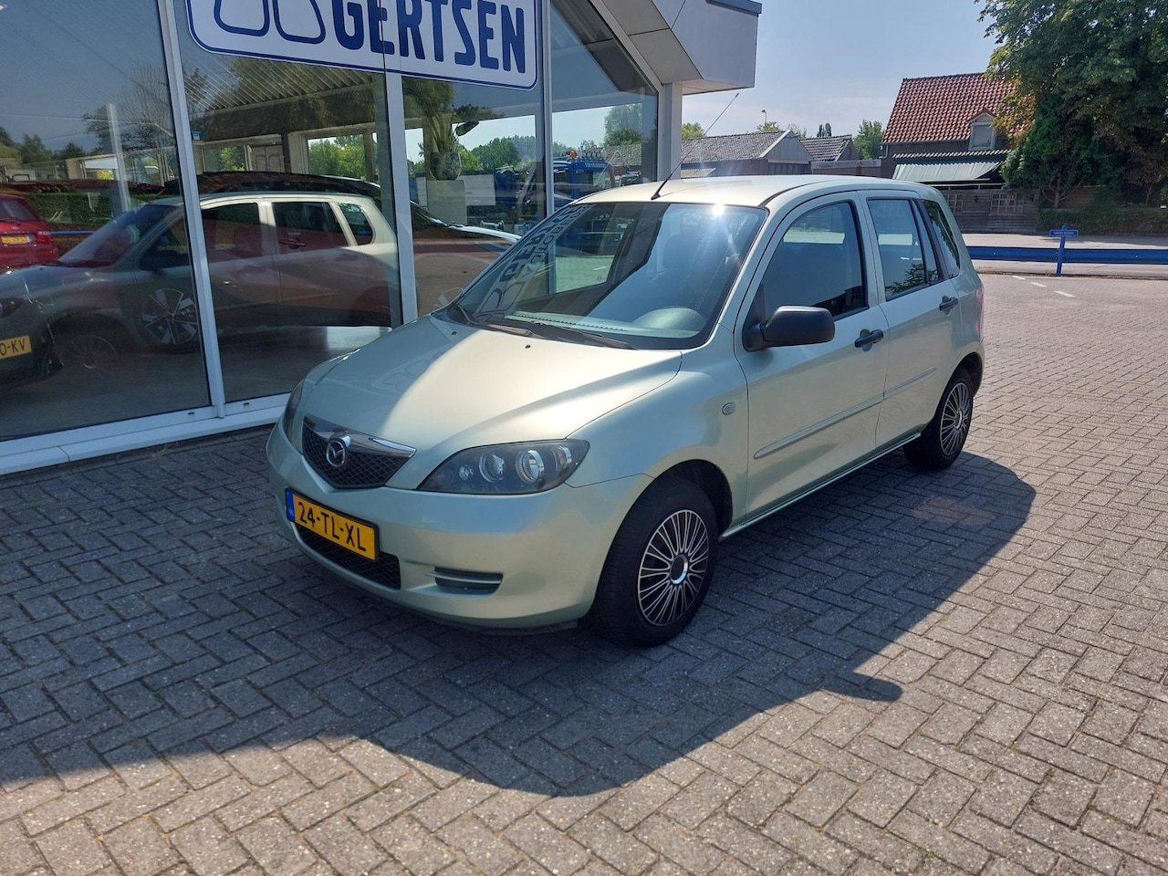 Mazda 2 - 1.4 Exclusive Budget topper, Hoge instap, weinig kilometers,  airco, - AutoWereld.nl