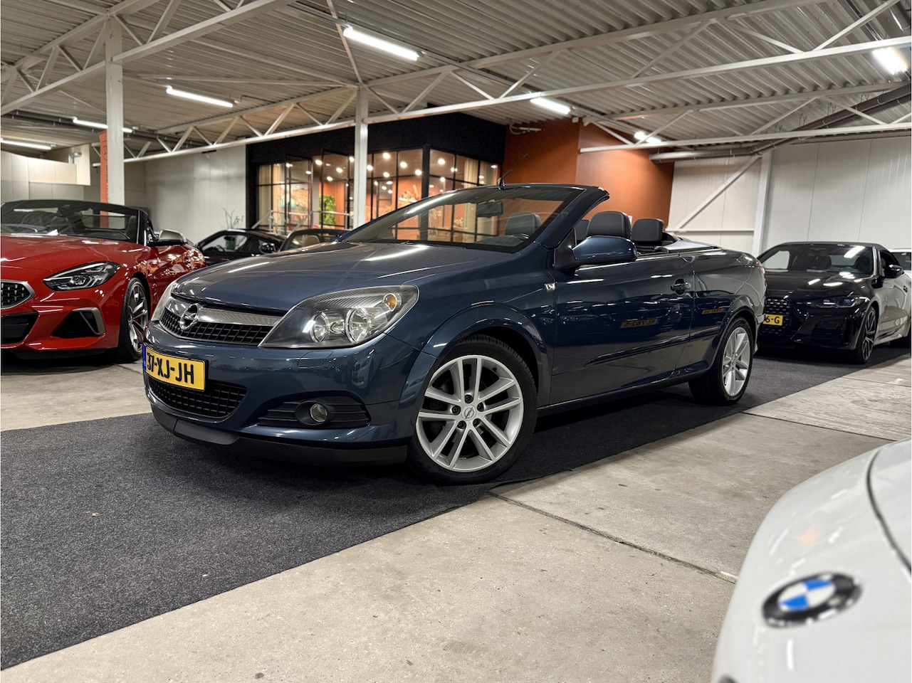 Opel Astra TwinTop - 1.8 Cosmo l Cruise l Navi l Clima l PDC l Sportonderstel l Lage tellerstand! - AutoWereld.nl